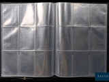 an open book with a silver cover on a black background