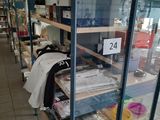 a glass case filled with lots of items in a store