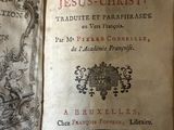an old book that is open on a table
