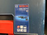 a box with a tool on the floor next to a tool box