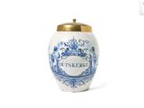 un vase bleu et blanc avec un couvercle doré