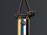 an image of a medal hanging from a chain with a star on it