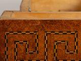 a wooden box that has a design on it