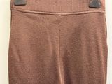 a close up of a pair of brown pants on a hanger