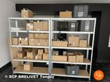 many boxes and boxes on the shelves in the room