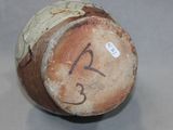 a close up of a vase with a number on it