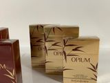 three boxes of oil sit on a table next to each other