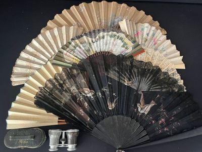 a fan and a pair of shoes on a table