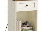 an image of a nightstand table with a clock and books