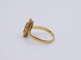 an image of a gold ring with a diamond in the center