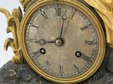 a clock that is sitting on top of a table