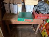 a wooden table with boxes and boxes on it in a room