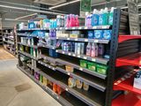 a lot of cleaning products on the shelves in the store