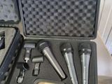 two microphones in a case sitting on top of a table