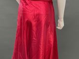the back of a mannequin wearing a red skirt