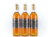 three bottles of whisky on a white background