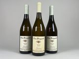 three bottles of wine sitting next to each other on a table