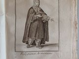 an old book with a picture of a man in a robe