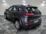 a black jeep parked in a room with a checkered floor