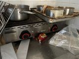 pots and pans sit on a stove in a kitchen