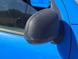 a close up of a car ' s side mirror and door handle