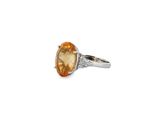 an oval citrine and diamond ring, set in 18k white gold