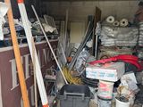 a garage with a lot of junk in it