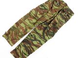 a pair of camouflage pants on a white surface