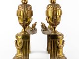 pair of antique brass figurines of a man and woman on pedestals
