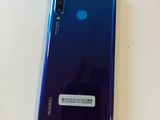 a close up of a purple and blue phone on a table