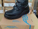a pair of black shoes on top of a cardboard box
