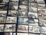 a lot of old postcards that are on the table
