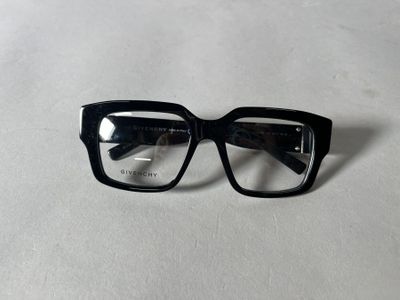 glasses on a table with a white surface and a white background