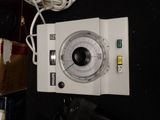 a picture of a white electronic device on a table