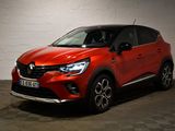 une voiture rouge garée dans un garage au sol en damier