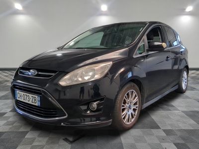 a picture of a black ford c - max parked on a checkered floor