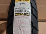 a close up of a motorcycle tire with a price tag on it