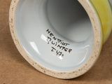 a close up view of a vase with writing on it