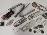 a lot of old metal objects on a white surface