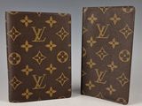 a pair of louis vuitt wallets