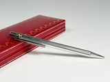 a pen sitting on top of a red box
