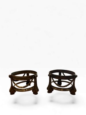 pair of antique iron stools with wooden legs