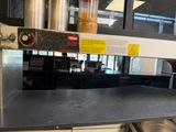 an image of a commercial kitchen with stainless steel counter tops
