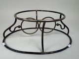 a black metal table with a glass top on a white surface