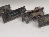 five pieces of metal that have been placed on a table