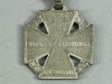 an image of a silver medal with a red ribbon around it