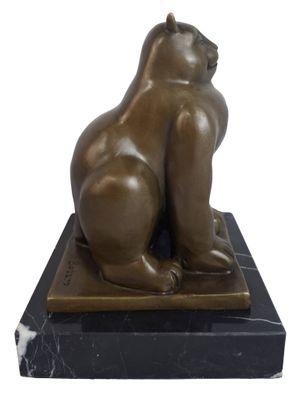 statue of a cat sitting on a marble base