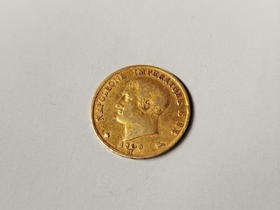 a close up of a coin on a table with a white background