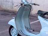 a scooter that is parked in a parking lot