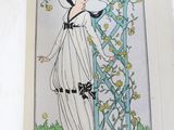 an open book with a drawing of a woman in a white dress